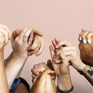 A group of people holding hands